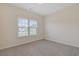 Bright bedroom with a large window and neutral carpeting at 200 Palm Terrace Loop, Conway, SC 29526