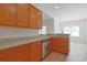 Charming kitchen featuring wood cabinets, granite countertops, and stainless steel appliances at 200 Palm Terrace Loop, Conway, SC 29526