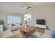 Bright living room with vaulted ceiling, ceiling fan, and lots of natural light at 200 Palm Terrace Loop, Conway, SC 29526