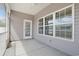 Enclosed patio with white trim door and multiple windows that let in natural light at 200 Palm Terrace Loop, Conway, SC 29526