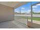 Covered outdoor patio area overlooking a yard enclosed with a white fence at 200 Palm Terrace Loop, Conway, SC 29526