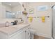 Bright bathroom with a stylish vanity, neutral color scheme, and tiled floor at 2039 Woodburn Dr., Myrtle Beach, SC 29579