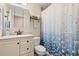 Cozy bathroom featuring a shower with floral curtain, and modern fixtures at 2039 Woodburn Dr., Myrtle Beach, SC 29579