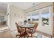 Charming breakfast nook featuring a round table, comfortable chairs, and serene views of the water at 2039 Woodburn Dr., Myrtle Beach, SC 29579