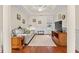Cozy living room featuring wood floors, chair railing, a ceiling fan, and lots of natural light at 2039 Woodburn Dr., Myrtle Beach, SC 29579