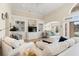 Bright living room featuring high ceilings, built-in shelving, comfortable seating, and serene view at 2039 Woodburn Dr., Myrtle Beach, SC 29579