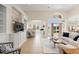 Open living room with high ceilings, built-in cabinets, seamless transition to the patio and a lovely interior design at 2039 Woodburn Dr., Myrtle Beach, SC 29579