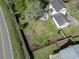 Aerial view of a home's expansive backyard with mature trees and a fenced perimeter at 205 Lander Dr., Conway, SC 29526
