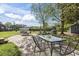 Spacious backyard featuring a concrete patio and string lights, perfect for outdoor entertaining at 205 Lander Dr., Conway, SC 29526