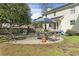 Inviting backyard with patio, grill, and shaded seating area, perfect for relaxing at 205 Lander Dr., Conway, SC 29526