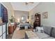 Bedroom showcasing wood-paneled wall, lamps, and an organized secretary desk paired with a comfortable sofa at 205 Lander Dr., Conway, SC 29526