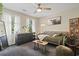 Cozy bedroom with natural light, bohemian decor, and a comfortable daybed, creating a tranquil retreat at 205 Lander Dr., Conway, SC 29526