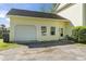 Attached yellow garage with a white door, windows and a side entrance for extra storage or parking at 205 Lander Dr., Conway, SC 29526