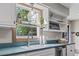 Bright kitchen showcasing a stainless steel faucet and ample natural light from a large window at 205 Lander Dr., Conway, SC 29526