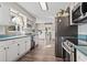 Bright kitchen with stainless steel appliances, white cabinets, and an open layout at 205 Lander Dr., Conway, SC 29526