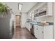 Bright kitchen featuring white cabinets, stainless steel appliances, and modern countertops at 205 Lander Dr., Conway, SC 29526