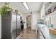 Modern kitchen with stainless steel appliances, white cabinets, and lots of natural light at 205 Lander Dr., Conway, SC 29526