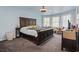 Serene bedroom with a large bed, neutral colors, and natural light, creating a relaxing atmosphere at 205 Lander Dr., Conway, SC 29526