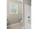Neutral tone bathroom with view from window and tile flooring at 211 Oak Landing Dr., Conway, SC 29527