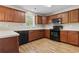 Functional kitchen features wood cabinets, white countertops, and modern appliances at 211 Oak Landing Dr., Conway, SC 29527