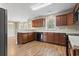 Well-lit kitchen with wood cabinets, spacious countertops, and updated appliances at 211 Oak Landing Dr., Conway, SC 29527