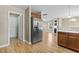 View of the kitchen featuring stainless steel refrigerator and hardwood floors at 211 Oak Landing Dr., Conway, SC 29527