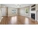 Inviting living room with fireplace and gleaming hardwood floors at 211 Oak Landing Dr., Conway, SC 29527