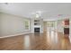Bright living room with fireplace, large windows, and hardwood floors at 211 Oak Landing Dr., Conway, SC 29527