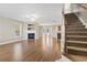 Spacious living room with fireplace, hardwood floors, and staircase at 211 Oak Landing Dr., Conway, SC 29527
