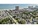 Spacious coastal community aerial view, featuring multi-story condos, lush greenery, and direct beach access at 212 Maison Dr. # M 303, Myrtle Beach, SC 29572
