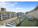 Open-air balcony offers a great view of the building and community pool at 212 Maison Dr. # M 303, Myrtle Beach, SC 29572