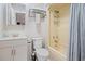 Bright bathroom offers classic fixtures, toilet, and a shower-tub combo with curtain at 212 Maison Dr. # M 303, Myrtle Beach, SC 29572