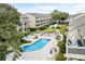 Inviting community pool with sun loungers surrounded by lush landscaping at 212 Maison Dr. # M 303, Myrtle Beach, SC 29572