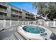 Community hot tub, surrounded by a white picket fence, offers a relaxing experience at 212 Maison Dr. # M 303, Myrtle Beach, SC 29572