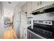 Well-equipped kitchen with stainless steel appliances and white cabinets, open to the dining area at 212 Maison Dr. # M 303, Myrtle Beach, SC 29572