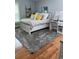 Bedroom with hardwood floors, grey walls, and neutral colors at 234 Ave. Of The Palms, Myrtle Beach, SC 29579