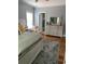 Bedroom with hardwood floors, grey walls, and ensuite bathroom at 234 Ave. Of The Palms, Myrtle Beach, SC 29579