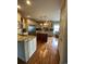 Bright kitchen with a central island, granite countertops, stainless steel appliances, and hardwood floors at 234 Ave. Of The Palms, Myrtle Beach, SC 29579