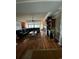 Open-concept living room features a fireplace, dark wood floors and an elegant leather sofa at 234 Ave. Of The Palms, Myrtle Beach, SC 29579