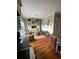 Cozy sitting area features a cabinet with glass doors, two chairs, and a rug at 234 Ave. Of The Palms, Myrtle Beach, SC 29579