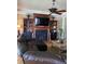 Spacious living room with fireplace, custom built-ins, and a comfortable leather sectional at 234 Ave. Of The Palms, Myrtle Beach, SC 29579