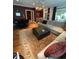 Spacious living room featuring a large sectional sofa, area rug, and dark accent wall at 234 Ave. Of The Palms, Myrtle Beach, SC 29579