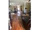 Open-concept living space flowing into the dining area, featuring hardwood floors and ample natural light at 234 Ave. Of The Palms, Myrtle Beach, SC 29579