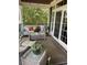 Cozy covered patio with comfortable seating and plants, ideal for outdoor enjoyment at 234 Ave. Of The Palms, Myrtle Beach, SC 29579