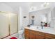 Bathroom with tile floor, shower with gold frame, and wood vanity with sink at 25 Bentley Ct., Pawleys Island, SC 29585