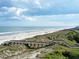 Scenic view of the beach, ocean, and boardwalk from an elevated vantage point at 25 Bentley Ct., Pawleys Island, SC 29585