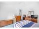Bedroom featuring white walls, blue carpet, and several wood furniture pieces at 25 Bentley Ct., Pawleys Island, SC 29585