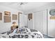 Bedroom with unique golf ball art, ceiling fan, and closet with mirrored doors at 25 Bentley Ct., Pawleys Island, SC 29585