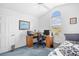 Bright bedroom with desk, two computer monitors, large window, and high ceilings at 25 Bentley Ct., Pawleys Island, SC 29585