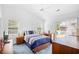 Comfortable bedroom with vaulted ceiling, ceiling fan, and sliding glass door to deck at 25 Bentley Ct., Pawleys Island, SC 29585